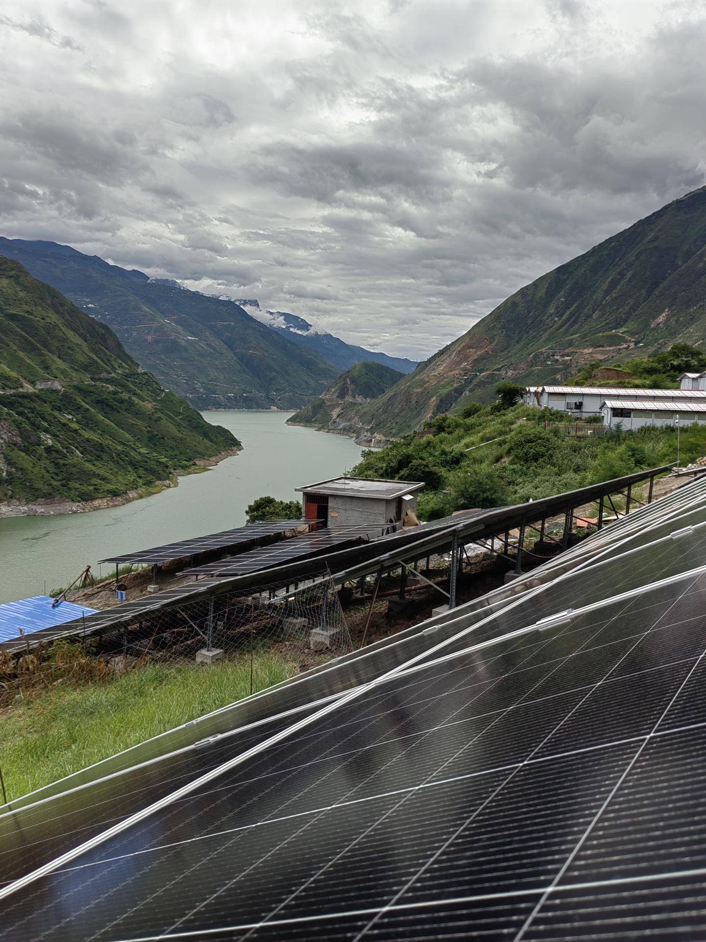 Village in the mountains with solar system