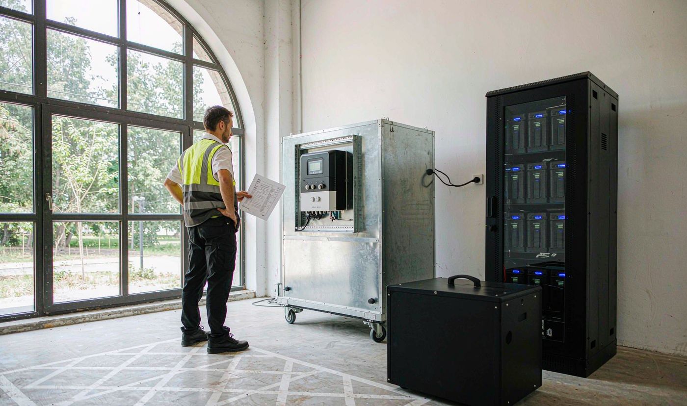 Commercial BESS cost: engineer checking a 50kW configuration sheet line by line
